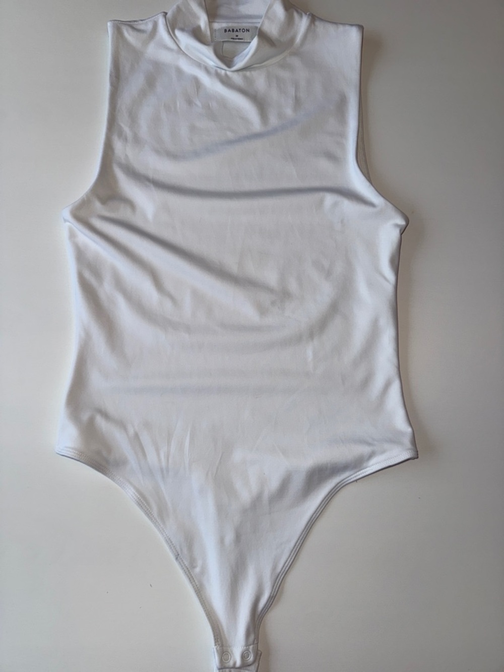 Babaton Kids White Sleeveless Mock Neck Bodysuit